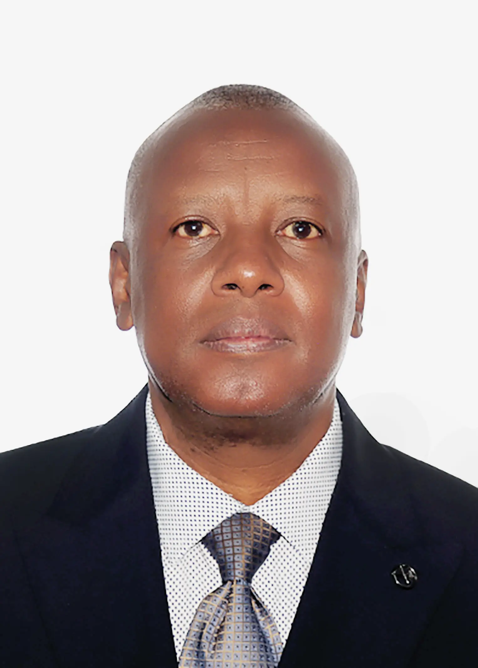 Portrait of the ADEPC senior pastor in a dark suit and patterned tie.